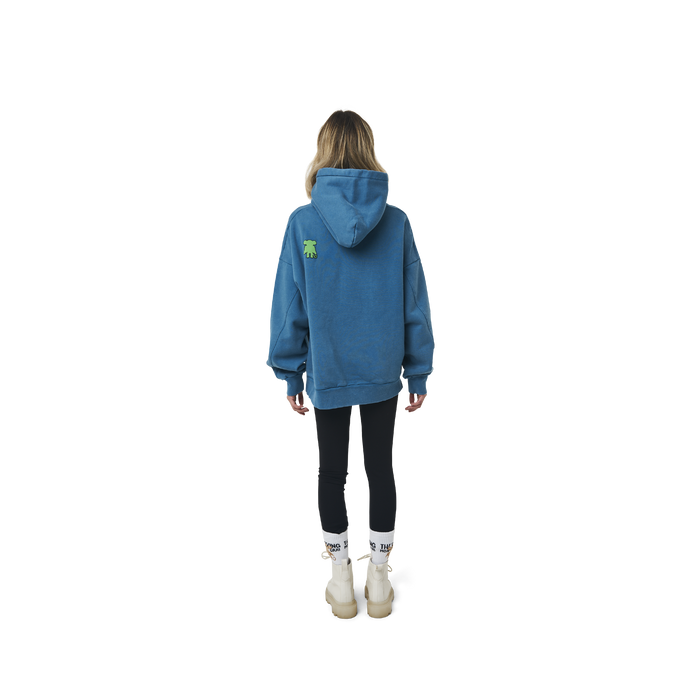 Long sleeves oversize cut hoodie in washed sapphire blue color fabric featuring ' The Flying Monkeys Club ' logo print at front and at back. 1886 logo embroidered at kangaroo pocket. Rib knit at cuffs and hem.