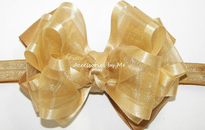 Gold Organza Satin Trim Bow attached to a Skinny Stretch Headband